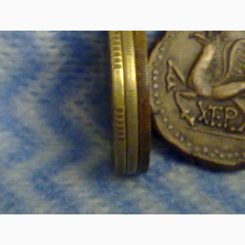 Фото 4. Древний Херсонес, реплика античной монеты, дева с луком и грифон