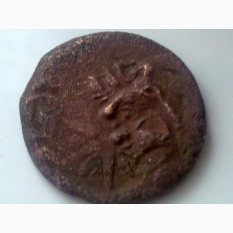 Фото 10. Древний Херсонес, реплика античной монеты, дева с луком и грифон
